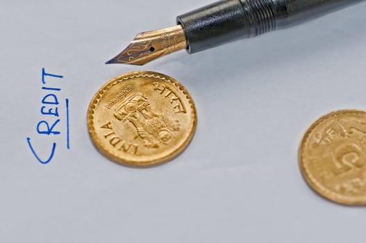 Close up of  accounting sheet, pen and coins, isolated, copy space