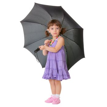Little girl with a big black umbrella isolated on white background