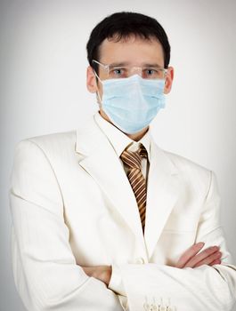 Doctor of Medicine with glasses and a mask