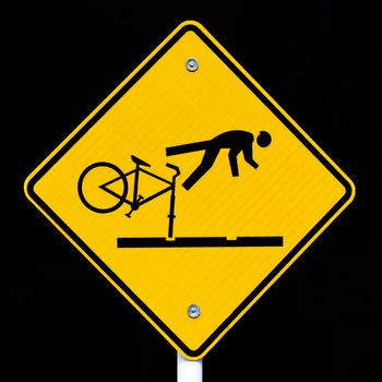 Road sign warning cyclists of dangerous tram tracks isolated on black background.