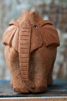 Handmade wooden elephant that was made out of a coconut.