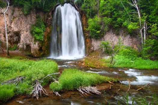 Summer view of Spearfish Falls in the Black Hills National Forest of South Dakota.