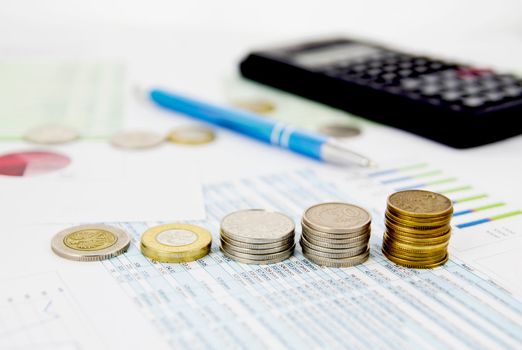 Coins stack on colorful business background