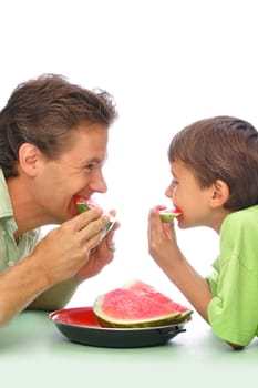 Father and son eating sliced watermelon together with white background