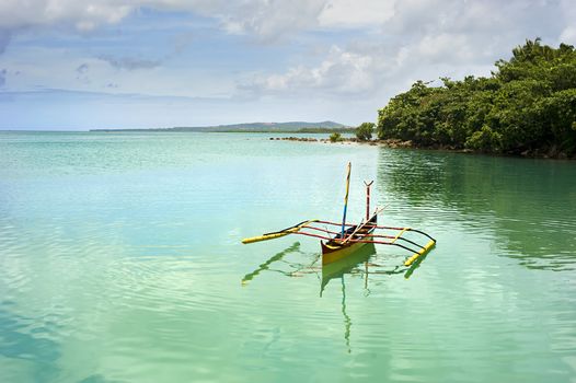 Tropical landscape with traditional Philippines boat on Calicoan island, Philippines