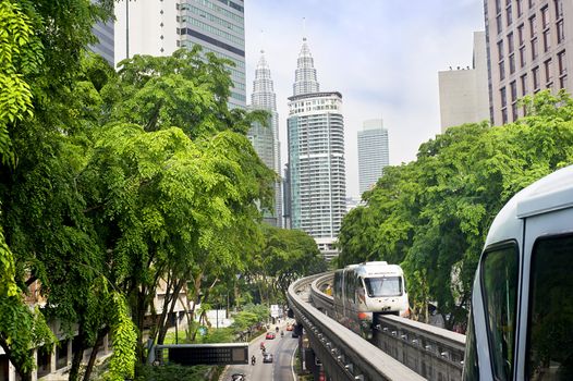 Kuala Lumpur, Malaysia - Marсh 20, 2012: Monorail train arrives at a train station. Kuala Lumpur metro consists of 6 metro lines operated by 4 operators.