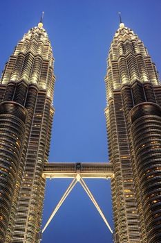 Kuala Lumpur, Malaysia - March 20, 2012:  Petronas Twin Towers  in Kuala Lumpur. Petronas Twin Towers  are twin skyscrapers in Kuala Lumpur, Malaysia.  They were the tallest buildings in the world from 1998 to 2004, but remain the tallest twin buildings ever built.