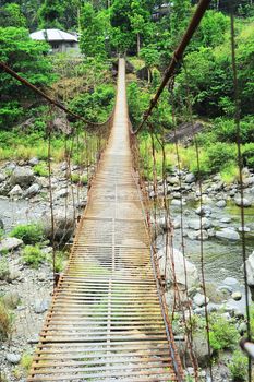 Suspension bridge in a small village. Cordillera mountains, Philippines