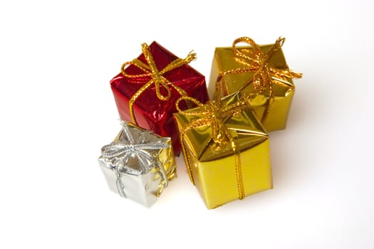 varicolored boxes with the gifts packed in them on a white background