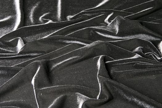 darkly-grey glossy velvet is formative folds and light-shadow picture