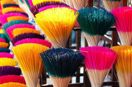 Colorful incense or joss sticks for buddhist prayers in Vietnam 