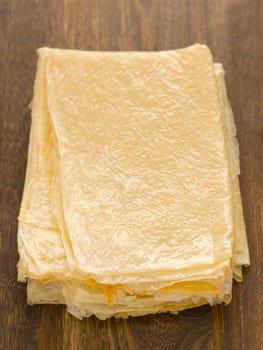 close up of a stack of beancurd sheets