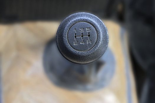 Stick shift with a black head inside auto