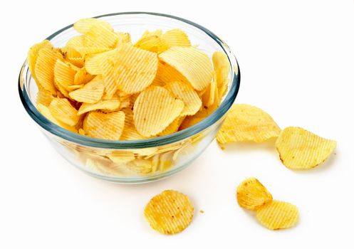 Potato chips in a glass bowl on white background