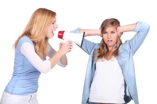 Girls screaming in a bullhorn and girl covering her ears