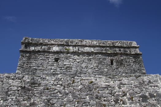 stone wall of mayan temple of Tulum