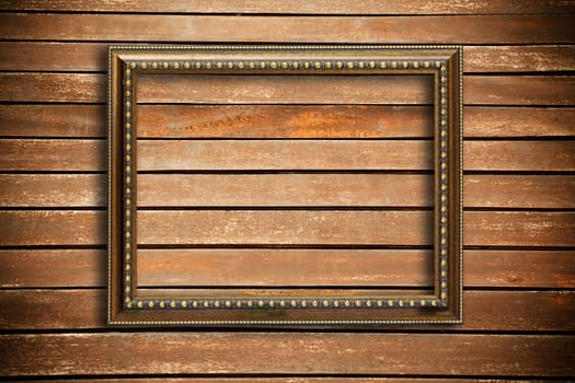 Photo frame on wood wall background