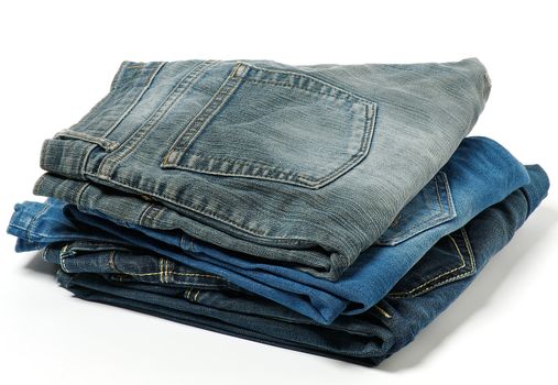 Stack of jeans isolated on white background