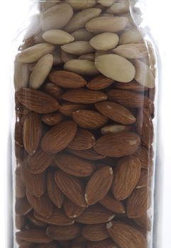 plain and peeled almond in a glass jar