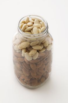 plain and peeled almond in a glass jar