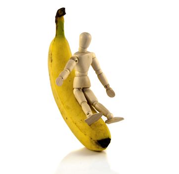 wooden puppet boy play with the banana