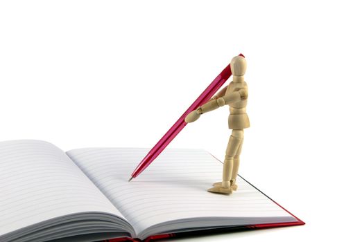 wooden puppet writing with red pencil