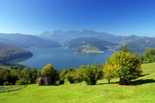 fresh summer landscape with Carpathian mountain and lake, Romania 