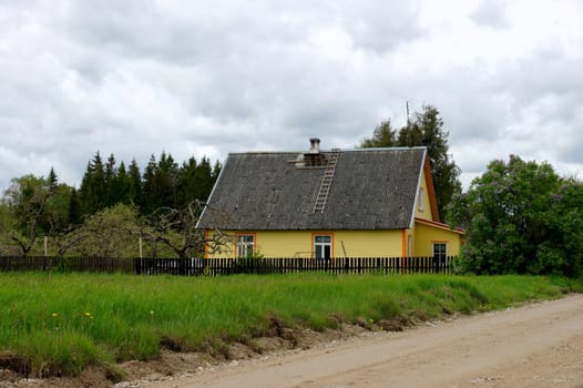 The house with an inclined roof at road