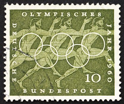 GERMANY - CIRCA 1960: a stamp printed in the Germany shows Sprinters, Sport Scene from Greek Urn, 17th Olympic Games, Rome, circa 1960
