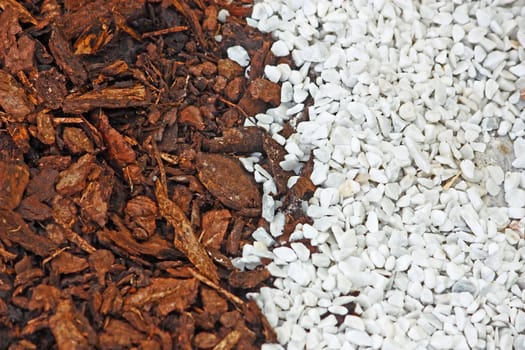 White-brown background made of brown bark and white pebbles