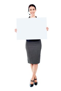 Telemarketing femlae holding a blank billboard. Full length portrait