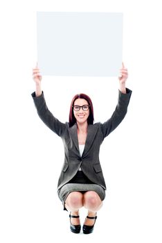 Seated corporate lady showing billboard over her head