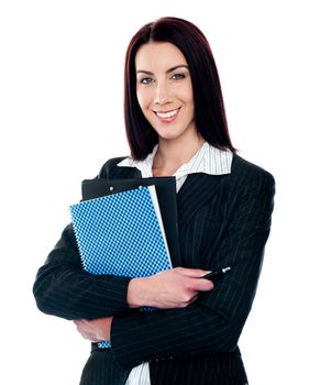 Portrait of smart smiling secretary holding file and smiling at camera