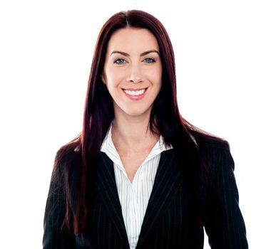 Smiling young female executive posing in style in front of camera