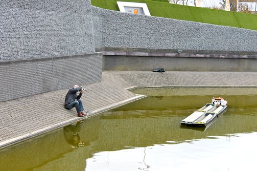 THE HAGUE, NETHERLANDS - APRIL 7: Photographer shoots in the park Madurodam. April 7, 2012 in Den Haag, The Netherlands