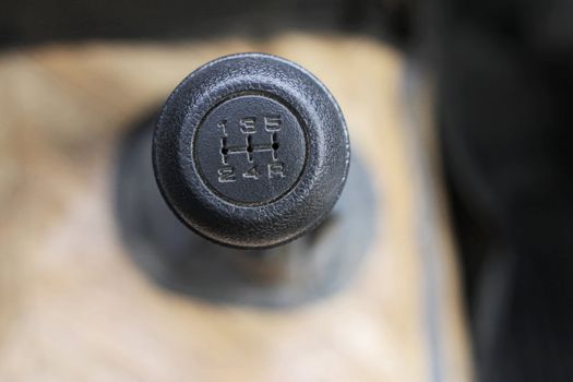 Stick shift with a black head inside auto