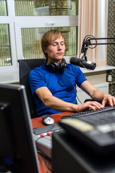 Dj working in front of a microphone on the radio