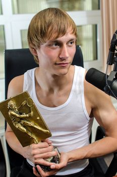 Tennis player with a prize on the radio station