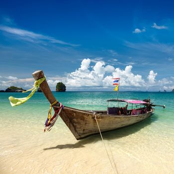 Long tail boat on tropical beach, Krabi, Thailand