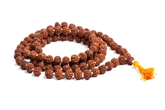 Buddhist or Hinduist Japa mala (prayer beads) made of rudraksha isolated