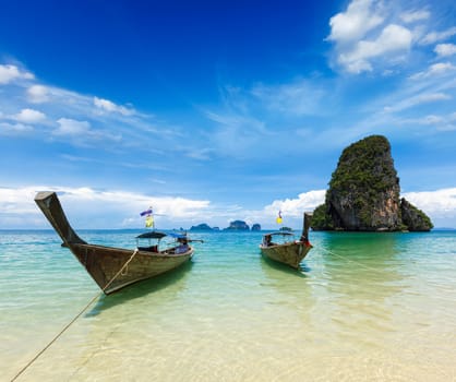 Long tail boats on tropical idyllic beach (Pranang beach), Krabi, Thailand