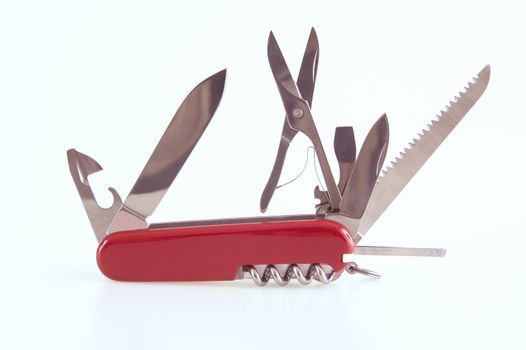 swiss army knife opened with many tools available