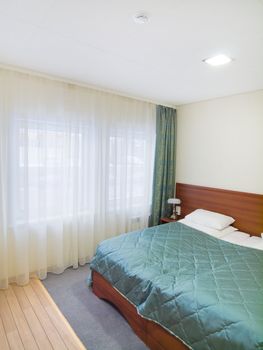 Bedroom with white pillows and sunny window