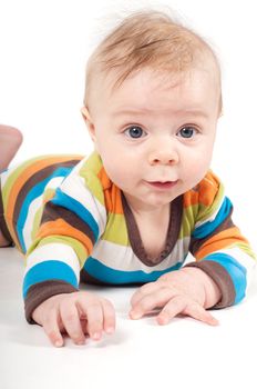 Shot of little baby lying on white background