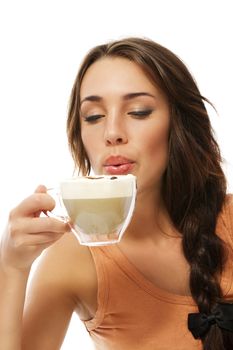 beautiful woman blow to her hot cappuccino on white background