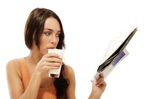 beautiful woman drinking latte macchiato coffee reading newspaper on white background