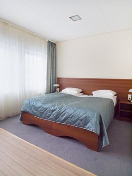 Bedroom with white pillows and sunny window