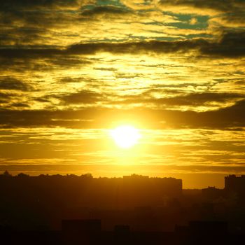 city sunrise close up yellow sky