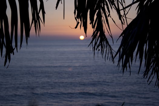 a vibrant sunset in mexico. with the ocean