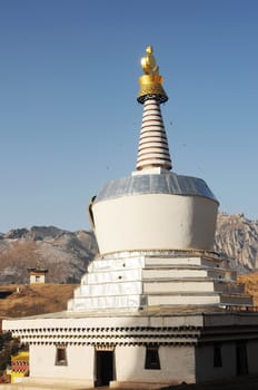 Landmark of white stupa in a Tibetan lamasery
